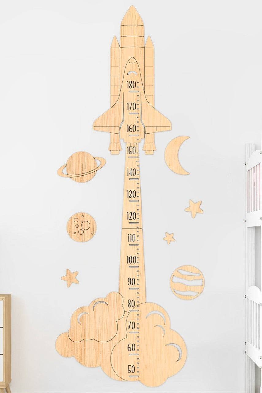 Personalized wooden rocket growth chart ruler with colorful planets and stars for kids' rooms.