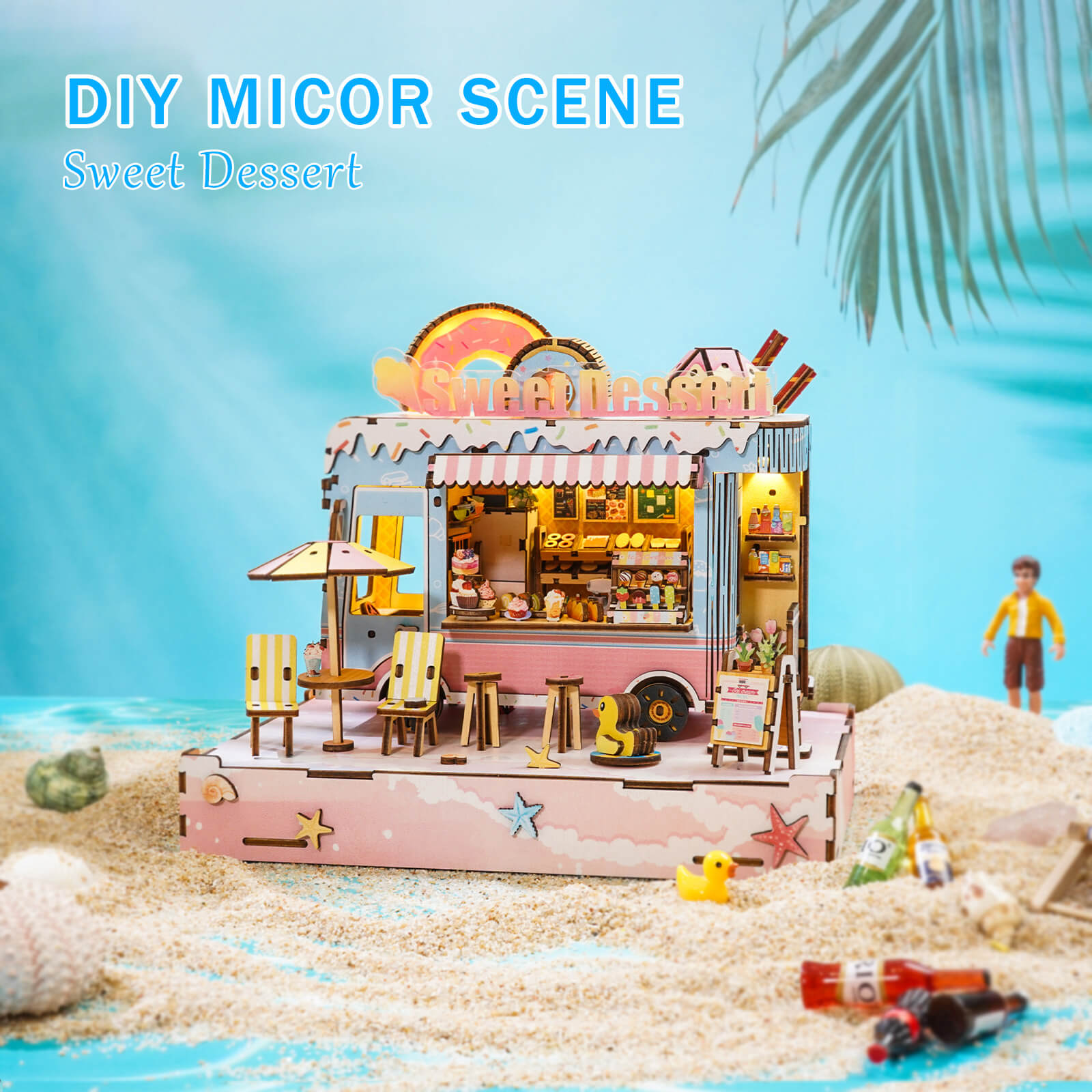 DIY miniature dessert cart scene with detailed wooden design on a sandy beach.