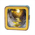 3D wooden puzzle night light featuring a sunset over a river, illuminated within a decorative box.