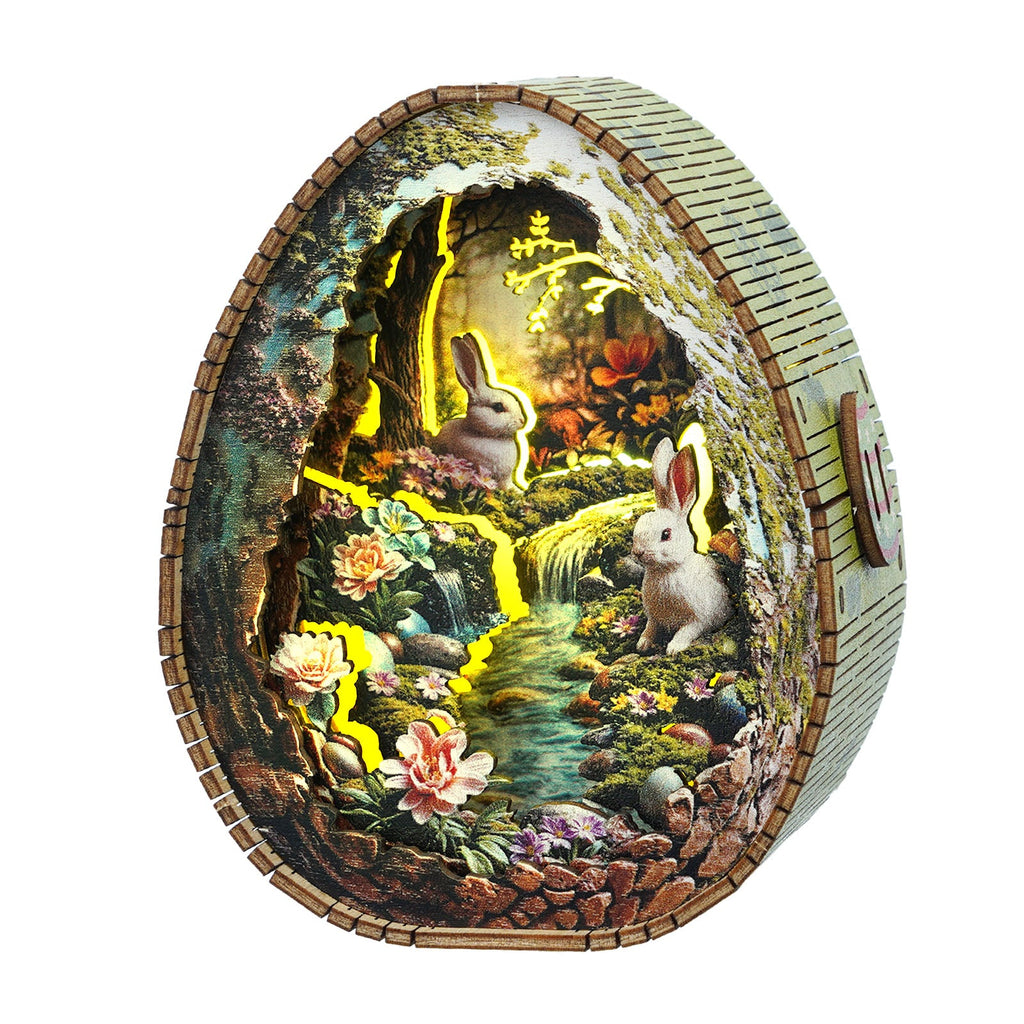3D wooden puzzle night light featuring a rabbit scene by a stream with flowers and soft glowing lights.
