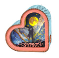 Heart-shaped 3D wooden puzzle night light featuring a romantic couple silhouette against a starry backdrop.