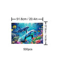 Undersea Paradise 500-piece puzzle illustration featuring dolphins and colorful marine life in vibrant underwater scene.