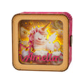 Personalized 3D wooden puzzle night light featuring a unicorn with the name Amelia, glowing softly against a starry background.
